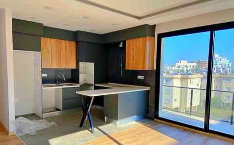 Современная квартира 2+1 в комплексе в центре Кирении с подземной парковкой