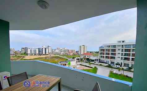 Роскошные квартиры с большими крытыми балконами 1+1,  в новом  современном комплексе  на берегу моря